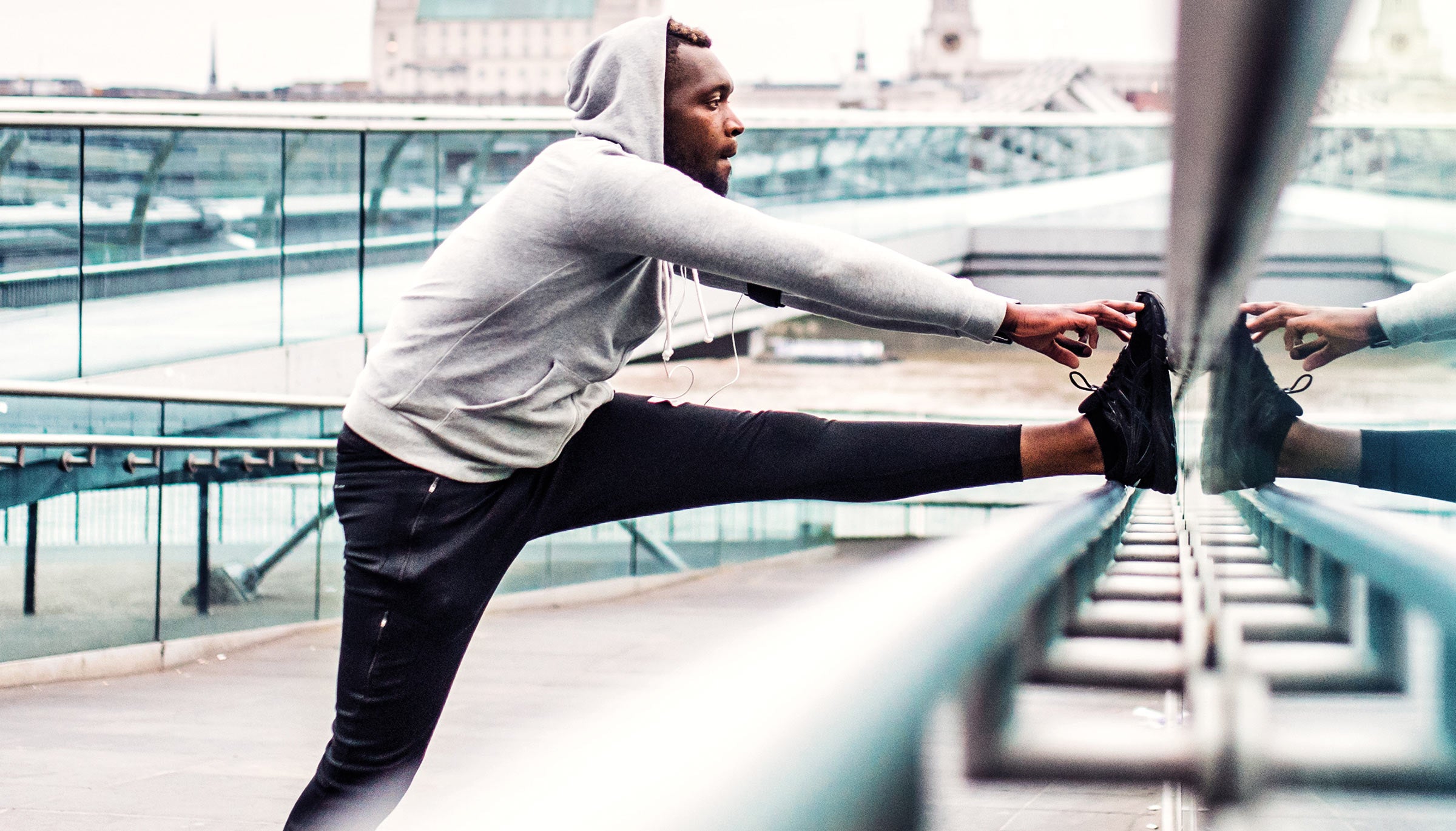 Man stretching during a run